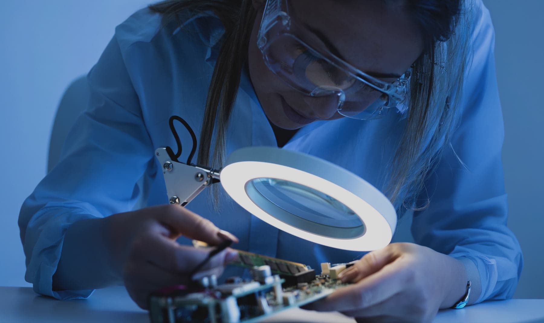 Engineer reviewing a VLSI chip design on a laptop